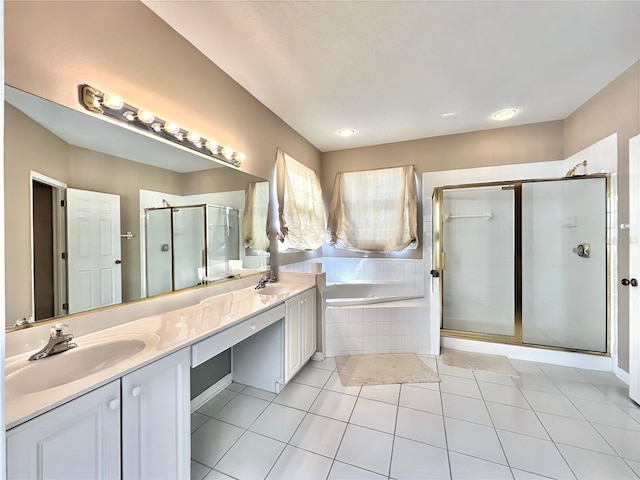 full bath with a stall shower, a garden tub, double vanity, and a sink