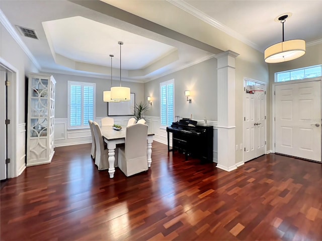 dining area with visible vents, a healthy amount of sunlight, and dark wood finished floors