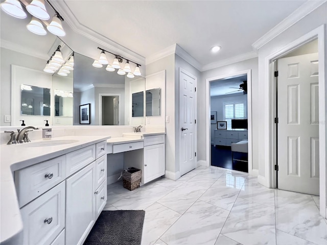 ensuite bathroom featuring baseboards, ornamental molding, marble finish floor, and vanity