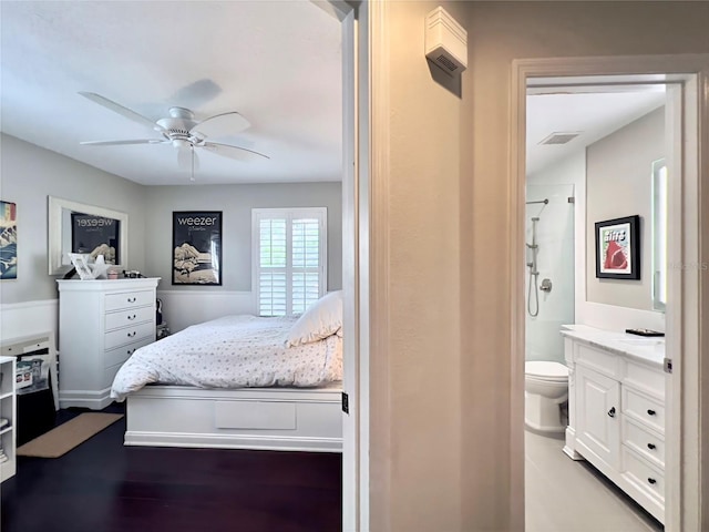 bedroom featuring ceiling fan and connected bathroom