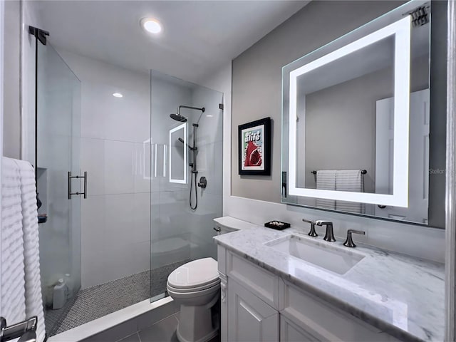 full bath with a shower stall, toilet, tile patterned flooring, and vanity