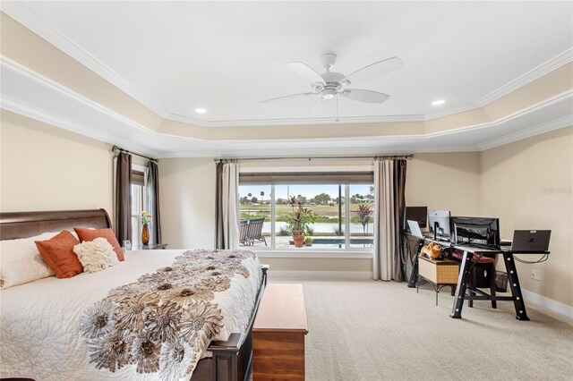 bedroom featuring crown molding, carpet floors, a raised ceiling, and baseboards