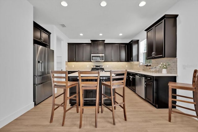 kitchen with visible vents, stainless steel appliances, light countertops, and recessed lighting