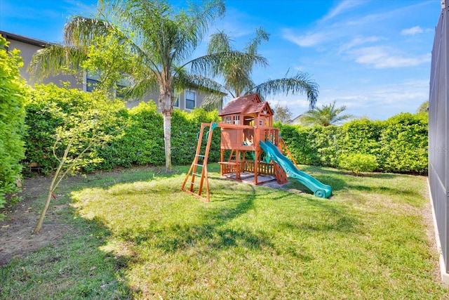 view of playground featuring a lawn