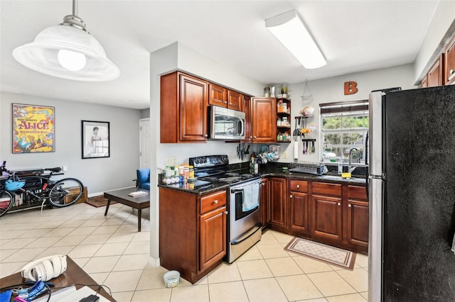 1239 E Ridgewood St, Orlando, FL 32803 - kitchen featuring open shelves, dark stone countertops, light tile patterned floors, and stainless steel appliances