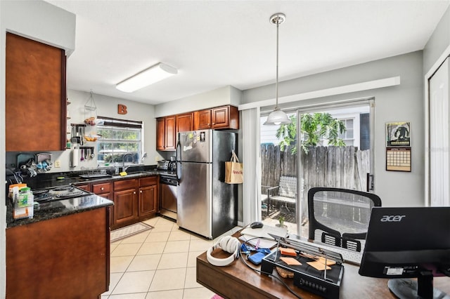 1239 E Ridgewood St, Orlando, FL 32803 - kitchen featuring light tile patterned floors, appliances with stainless steel finishes, pendant lighting, and a sink
