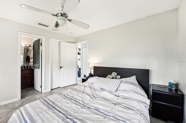 1239 E Ridgewood St, Orlando, FL 32803 - bedroom featuring baseboards, ensuite bathroom, ceiling fan, and visible vents