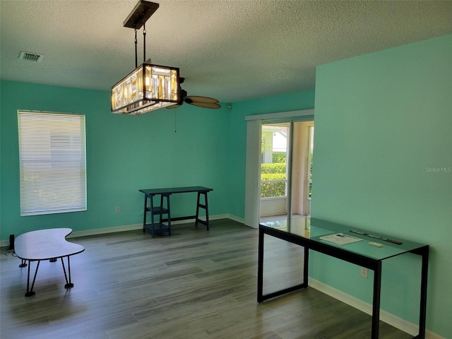 3586 Eversholt St, Clermont, FL 34711 - office with a textured ceiling, wood finished floors, a ceiling fan, and baseboards