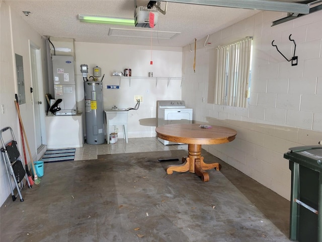 3586 Eversholt St, Clermont, FL 34711 - garage featuring electric water heater, a garage door opener, washer / dryer, heating unit, and electric panel