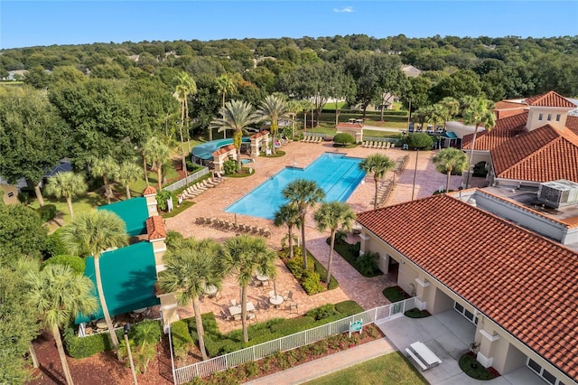 3586 Eversholt St, Clermont, FL 34711 - aerial view of a pool and a heavily wooded area