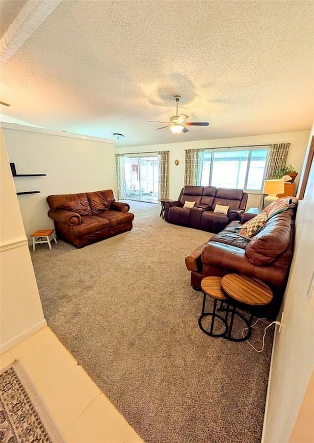600 Lake St, Fruitland Park, FL 34731 - carpeted living area featuring ceiling fan and a textured ceiling