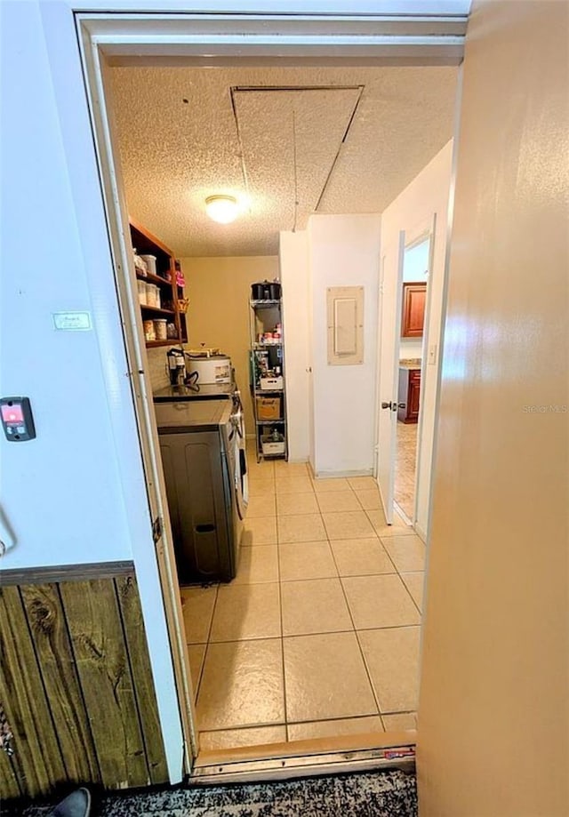 600 Lake St, Fruitland Park, FL 34731 - clothes washing area with light tile patterned floors, laundry area, and washing machine and dryer