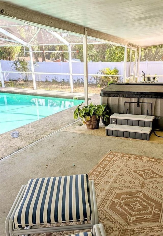 600 Lake St, Fruitland Park, FL 34731 - pool featuring a lanai, a hot tub, a patio, and a fenced backyard