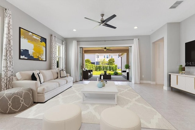 living room featuring visible vents, a ceiling fan, a healthy amount of sunlight, and recessed lighting