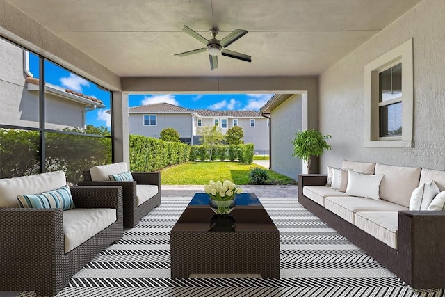 view of patio / terrace featuring an outdoor living space and ceiling fan
