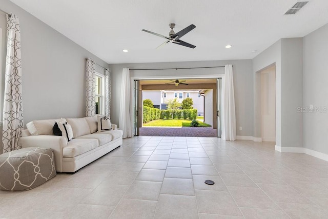 living area with visible vents, a ceiling fan, a healthy amount of sunlight, and recessed lighting