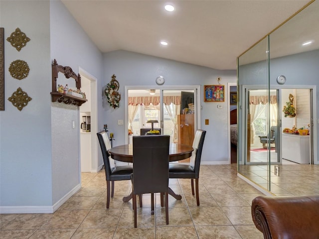 dining space with light tile patterned floors, recessed lighting, vaulted ceiling, and baseboards