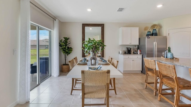 dining space with recessed lighting, light tile patterned flooring, and visible vents