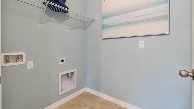 washroom featuring tile patterned flooring, laundry area, hookup for an electric dryer, washer hookup, and baseboards