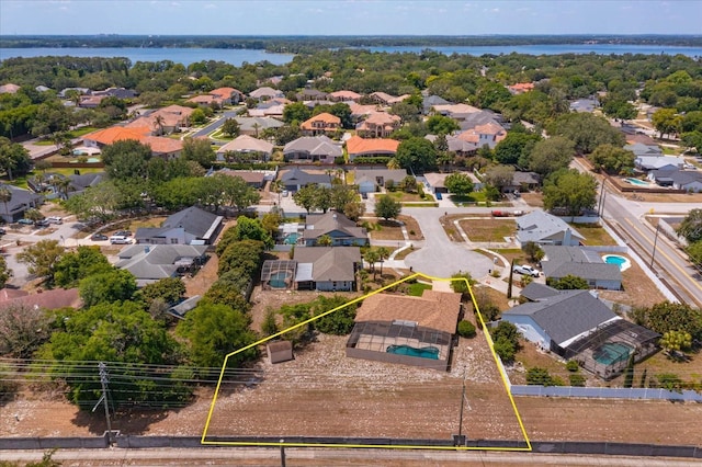 bird's eye view featuring a water view and a residential view