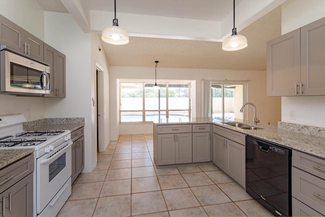 kitchen with stainless steel microwave, a sink, black dishwasher, white range with gas stovetop, and gray cabinetry
