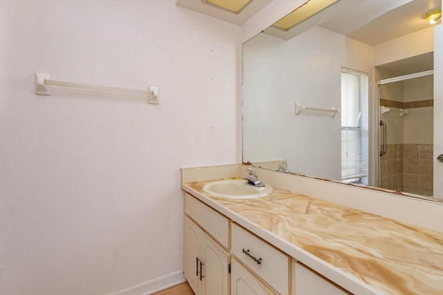 bathroom featuring vanity and a stall shower