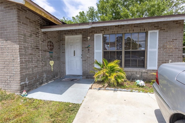 349 Caldbeck Way, Kissimmee, FL 34758 - property entrance featuring brick siding and a patio area
