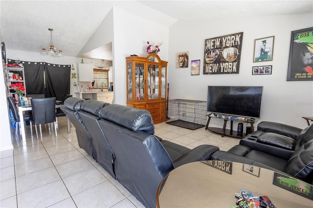 349 Caldbeck Way, Kissimmee, FL 34758 - living room with light tile patterned floors, lofted ceiling, and a chandelier
