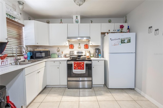 349 Caldbeck Way, Kissimmee, FL 34758 - kitchen featuring stainless steel range with electric cooktop, black microwave, a sink, freestanding refrigerator, and under cabinet range hood