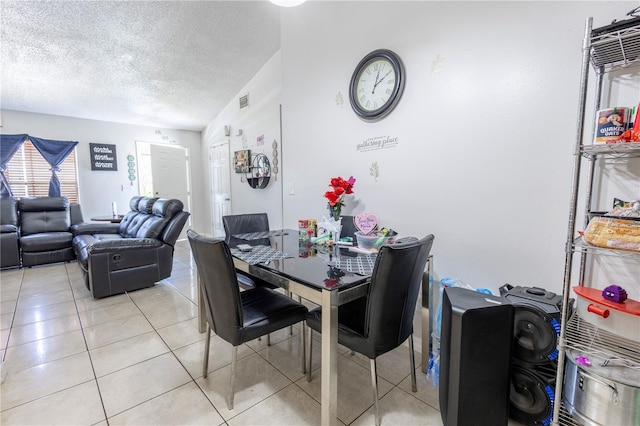 349 Caldbeck Way, Kissimmee, FL 34758 - dining room featuring visible vents, a textured ceiling, and light tile patterned flooring