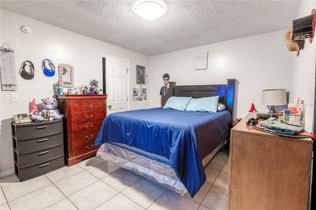 349 Caldbeck Way, Kissimmee, FL 34758 - bedroom featuring a textured ceiling and light tile patterned floors