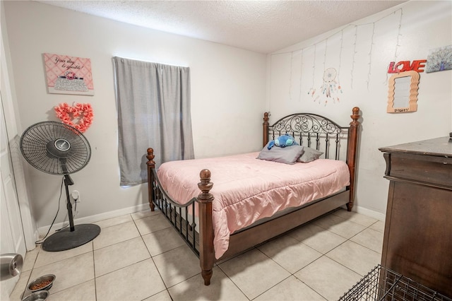349 Caldbeck Way, Kissimmee, FL 34758 - bedroom featuring baseboards, a textured ceiling, and light tile patterned floors