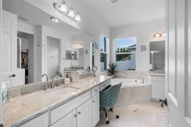 full bathroom with vanity, marble finish floor, visible vents, a garden tub, and a stall shower