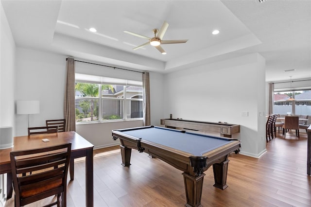 playroom featuring billiards, a raised ceiling, ceiling fan, and wood finished floors