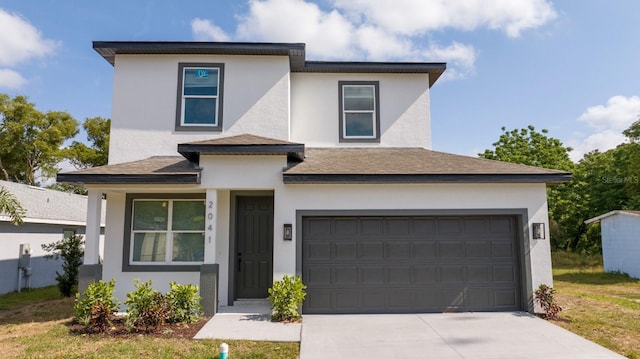 2041 Warrens Ave, Maitland, FL 32751 - prairie-style house featuring roof with shingles, stucco siding, and driveway