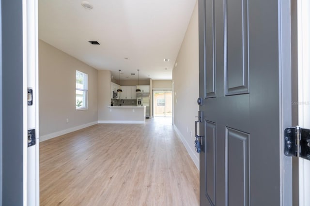 2041 Warrens Ave, Maitland, FL 32751 - entryway with light wood-type flooring, baseboards, and visible vents