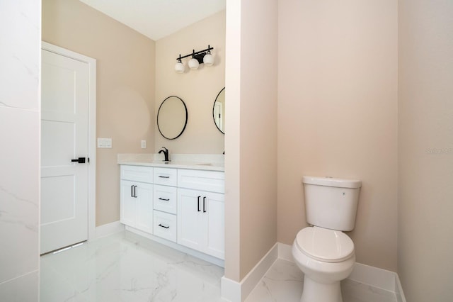 2041 Warrens Ave, Maitland, FL 32751 - bathroom featuring baseboards, vanity, toilet, and marble finish floor