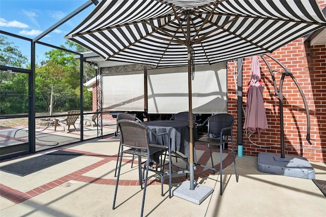view of patio with glass enclosure