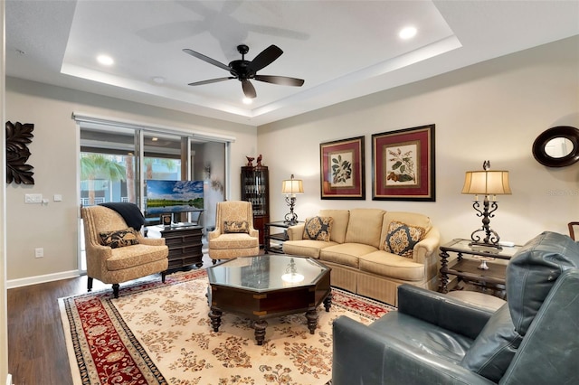 1767 Piedmont Pl, Lake Mary, FL 32746 - living room with a raised ceiling, ceiling fan, and wood finished floors