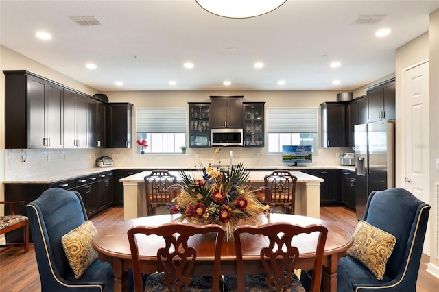 1767 Piedmont Pl, Lake Mary, FL 32746 - kitchen with backsplash, stainless steel appliances, plenty of natural light, and light wood finished floors