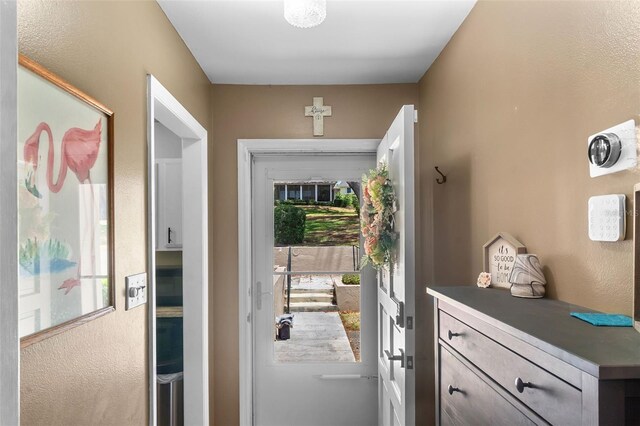doorway to outside featuring a healthy amount of sunlight