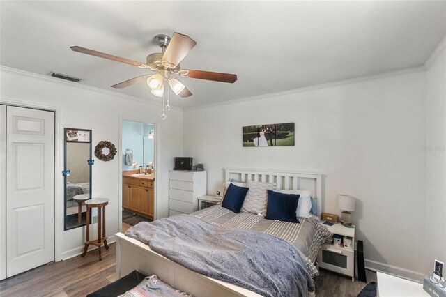 bedroom with visible vents, a ceiling fan, crown molding, and wood finished floors