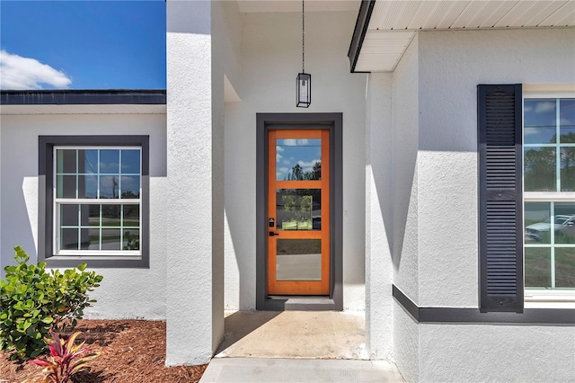 13430 SW 88th Ter, Ocala, FL 34473 - doorway to property featuring stucco siding