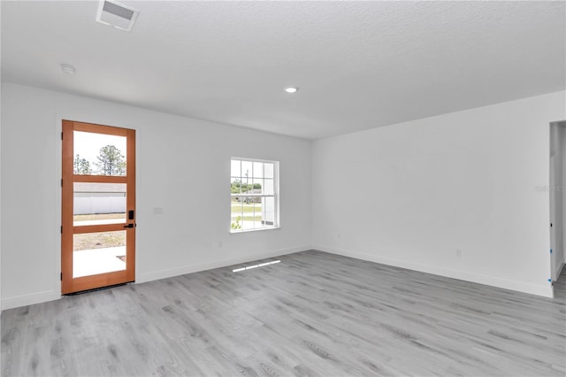 13430 SW 88th Ter, Ocala, FL 34473 - empty room with visible vents, recessed lighting, light wood finished floors, and baseboards