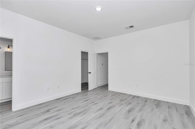 13430 SW 88th Ter, Ocala, FL 34473 - unfurnished room featuring baseboards, light wood-type flooring, and visible vents
