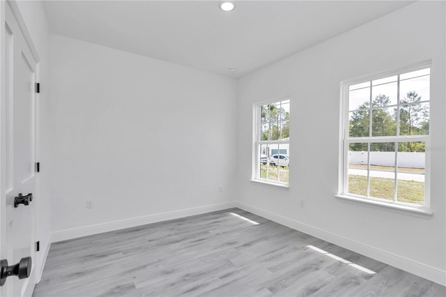 13430 SW 88th Ter, Ocala, FL 34473 - spare room with plenty of natural light, recessed lighting, baseboards, and light wood finished floors