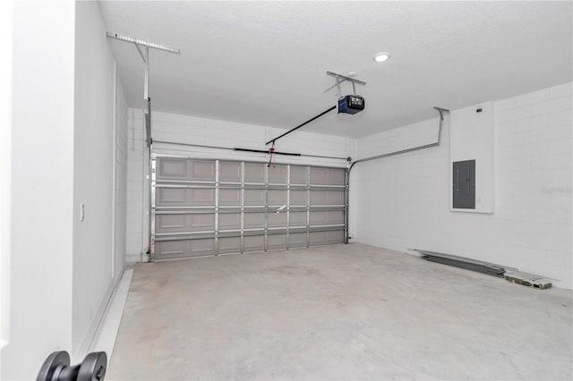 13430 SW 88th Ter, Ocala, FL 34473 - garage featuring concrete block wall, a garage door opener, and electric panel