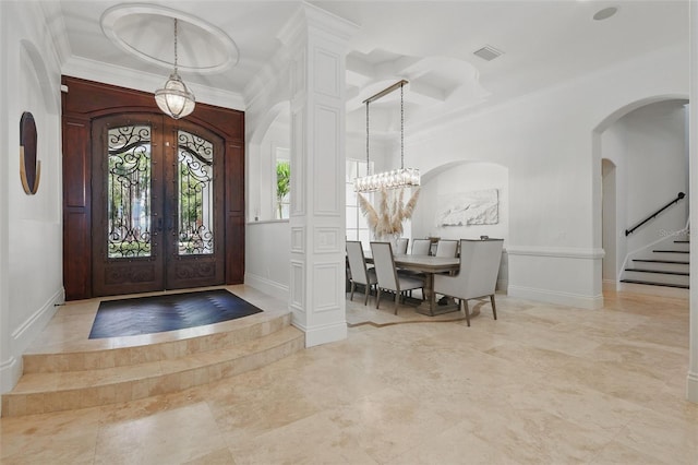 5550 Osprey Isle Ln, Orlando, FL 32819 - foyer with a decorative wall, arched walkways, french doors, visible vents, and ornamental molding