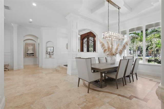 5550 Osprey Isle Ln, Orlando, FL 32819 - dining area with visible vents, crown molding, arched walkways, baseboards, and recessed lighting