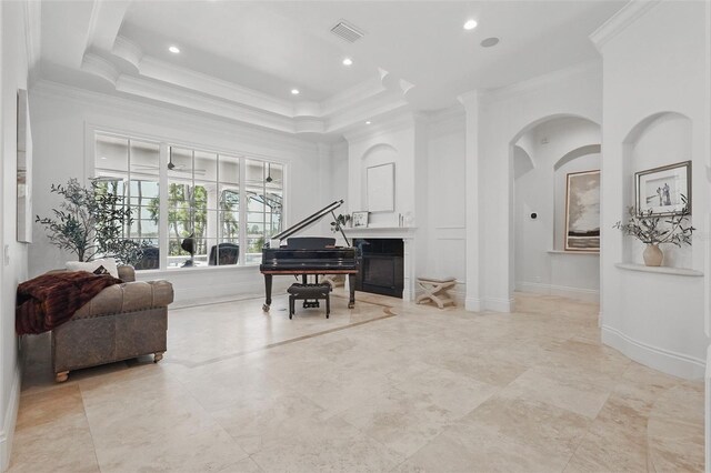 5550 Osprey Isle Ln, Orlando, FL 32819 - living area with visible vents, ornamental molding, a tray ceiling, and recessed lighting